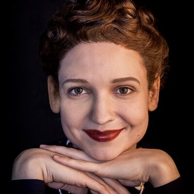 Step into the nostalgia of the 1940s with this captivating image featuring Eli S. The meticulously styled hairstyle, created with waves, curls, and papilots, perfectly complements the vintage makeup, transporting you to a bygone era of glamour and sophistication. #1940s #VintageGlamour ✨👗💄 Close-up photograph of a model with a 1940s hairstyle and vintage makeup, featuring waves, curls, and papilots. The model exudes timeless elegance, embodying the glamour of the era.