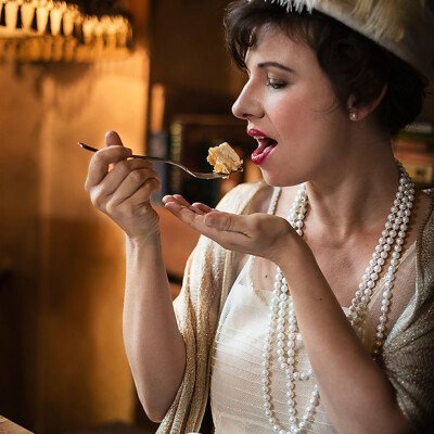 Transport yourself to the opulent world of the 1920s with Natascha Vinzenta as she channels the glamour of Gatsby's parties. With vintage elegance and Art Deco flair, this image captures the timeless allure of the Jazz Age. #GatsbyGlamour #VintageElegance #RoaringTwenties 🎩✨🍾 Vintage-inspired portrait of model Natascha Vinzenta in a glamorous 1920s ensemble against an Art Deco backdrop. She exudes sophistication and elegance, embodying the spirit of the Roaring Twenties. Photographed by Raisa Gelofre.