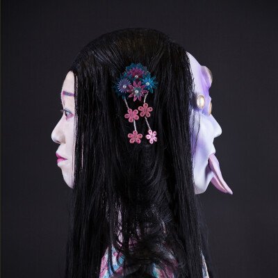 Witness the convergence of beauty and myth as Anett Alexandra Bulano unveils her spellbinding creation—a geisha adorned in elegance, yet haunted by the spirit of Tsuchigumo. 🕷️✨ #GeishaMakeup #JapaneseFolklore #SFXArtistry Side profile of a geisha adorned with traditional makeup and a Heian-period wig, juxtaposed with a spider mask featuring six yellow eyes and fangs. Created by makeup artist Anett Alexandra Bulano, inspired by Japanese folklore.